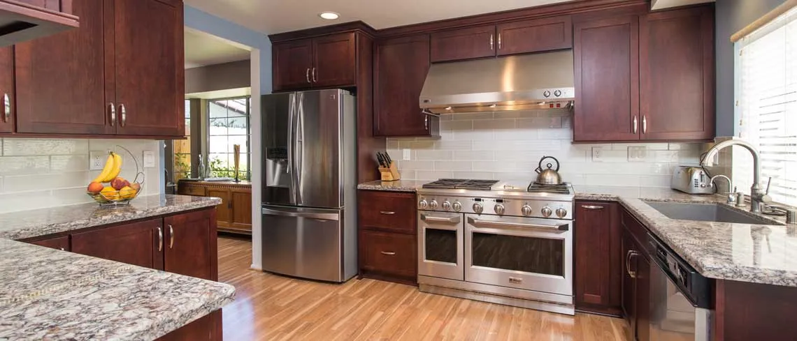 Bridgeport door style in Cherry finished in Brittany Kitchen Cabinet | Raby Home Solutions