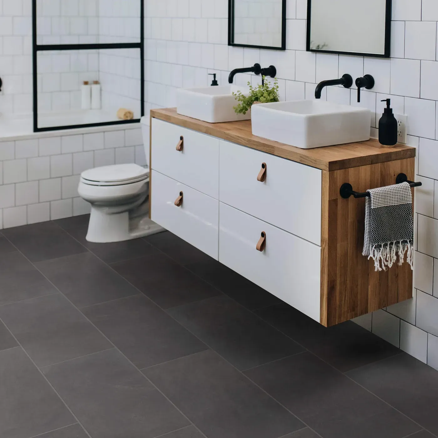Callisto-12x24-430TS-Ember-00900-RM-V Shaw Floors Ember dark gray rectangular tile in a modern bathroom