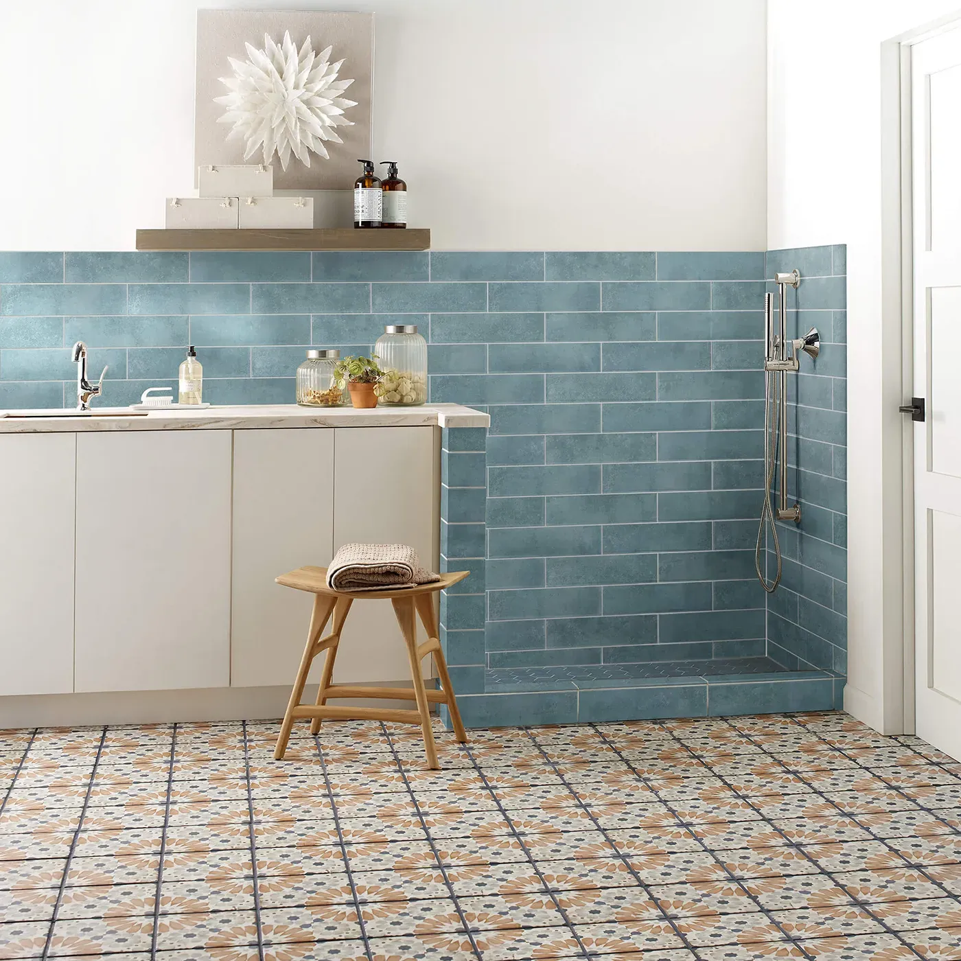 Noble-306TS-00450-Mint-3x12-RM-V Mint blue subway tile on the wall and multi-colored patterned tile on the floor